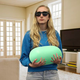 A blind woman holding an enormous Tic Tac.